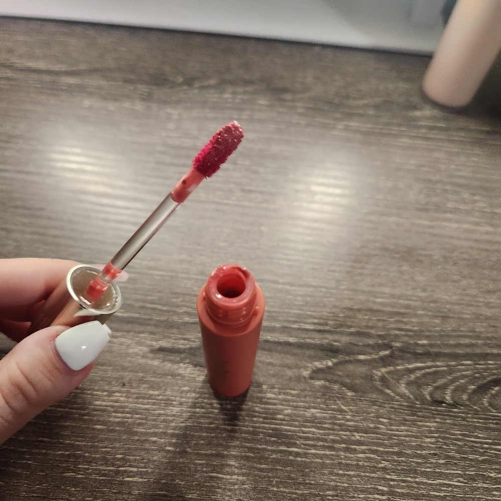 rare beauty lip gloss in shade happy